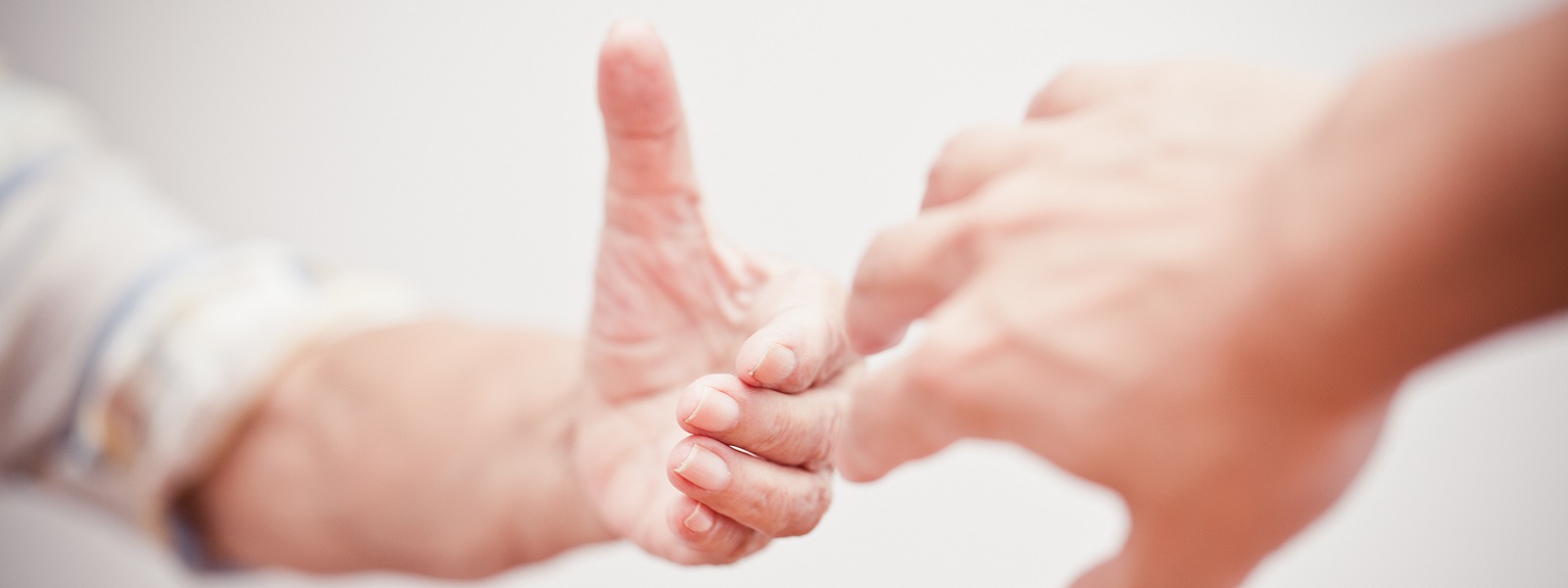 Two hands reaching out to each other