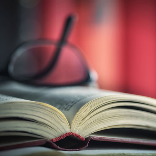 book with glasses