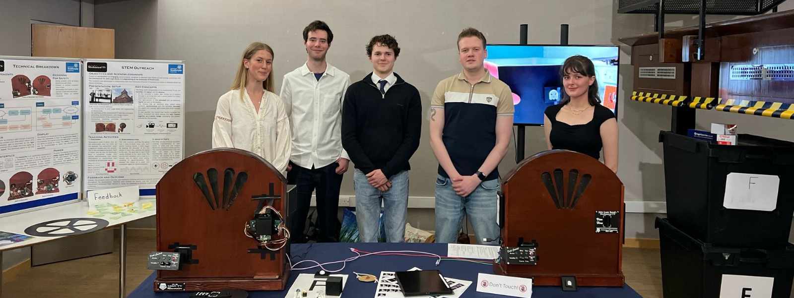 Engineering students showcasing their John Logie Baird replica device