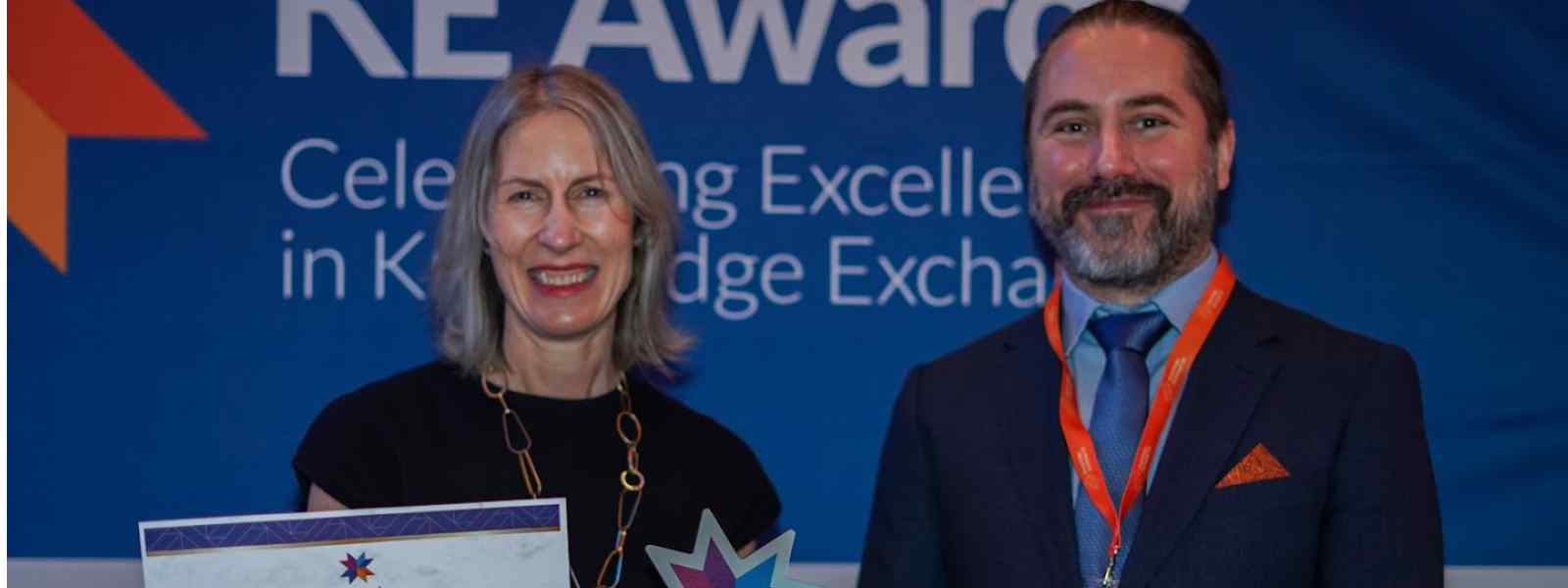 Lindsey Shields, Industry Engagement & Commercialisation Manager with Strathclyde’s Innovation and Industry Engagement Directorate, receives the Transformative Social Venture of the Year award from ESRC Deputy Director Huw Vasey. Photo KE Awards 2024