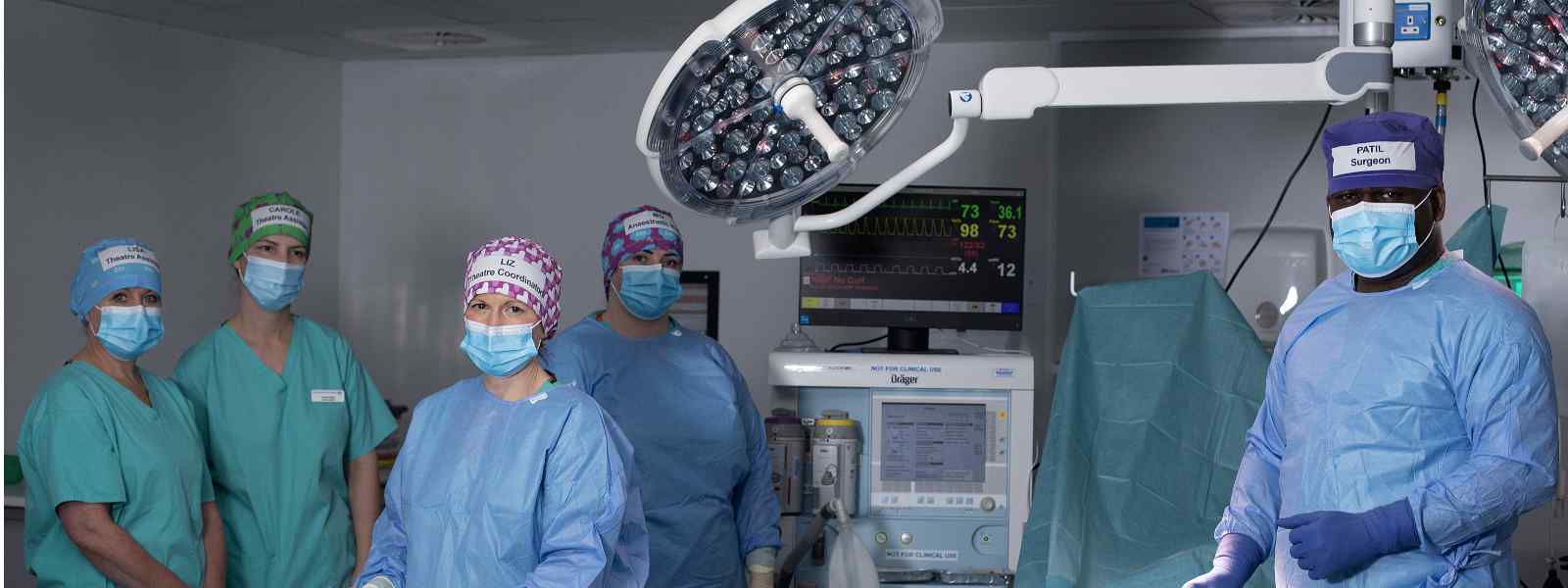 NHS staff wearing reusable caps designed in a Strathclyde and Heriot-Watt University project. Photo by Marsaili Mainz 